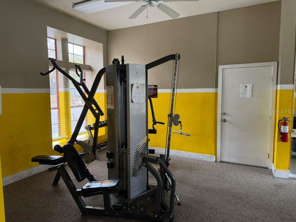 199 Afton Square, Unit 103 Altamonte Springs, FL 32714 - Photo 19 of 21 a view of a room with gym equipment