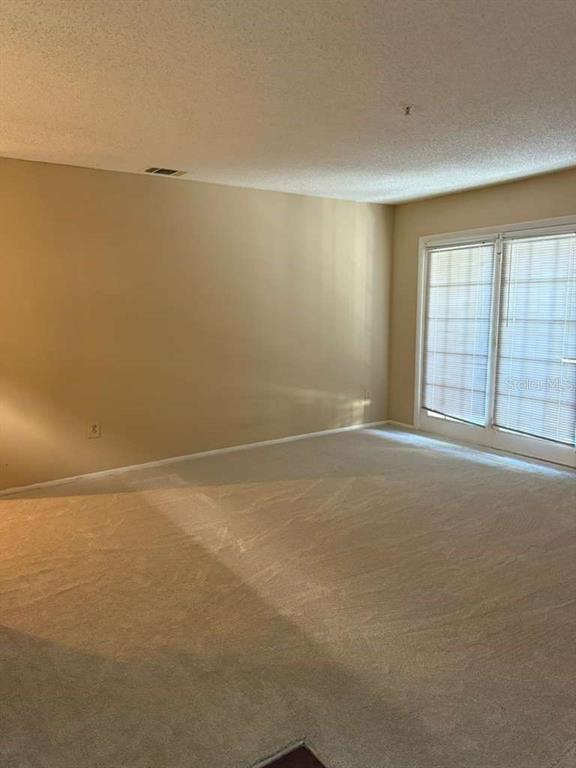 199 Afton Square, Unit 103 Altamonte Springs, FL 32714 - Photo 2 of 21 a view of an empty room with a window