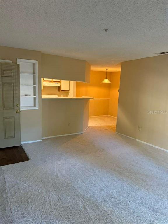 199 Afton Square, Unit 103 Altamonte Springs, FL 32714 - Photo 4 of 21 a view of an empty room with a window