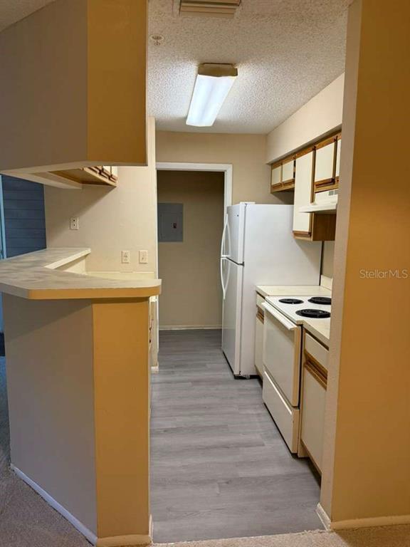 199 Afton Square, Unit 103 Altamonte Springs, FL 32714 - Photo 6 of 21 a kitchen with a refrigerator sink and stove