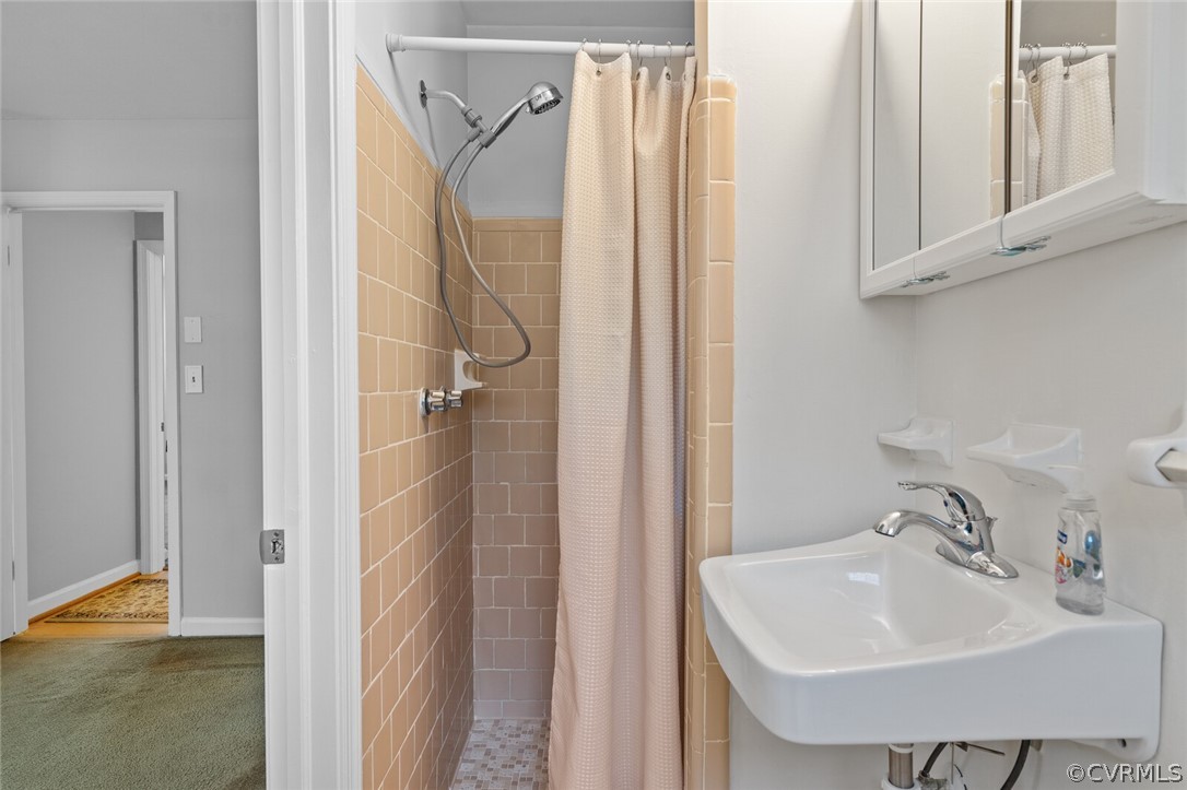 4541 Crossgate Road Chester, VA 23831 - Photo 33 of 47 a bathroom with a sink and a mirror
