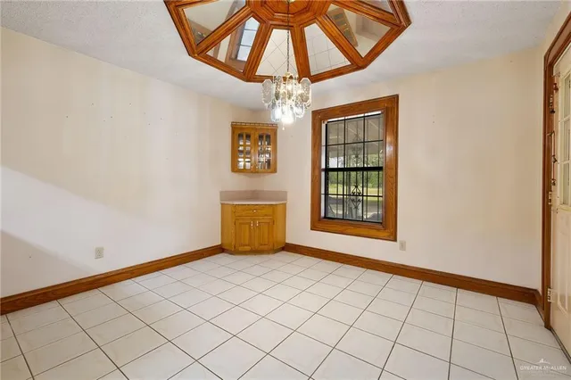 a view of an empty room and window