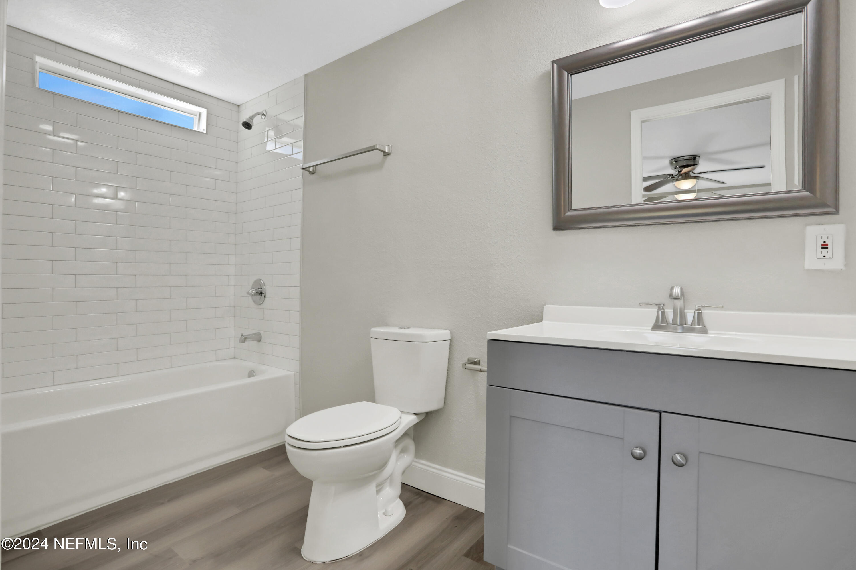 54057 Bea Road Callahan, FL 32011 - Photo 13 of 29 a bathroom with a toilet sink and mirror
