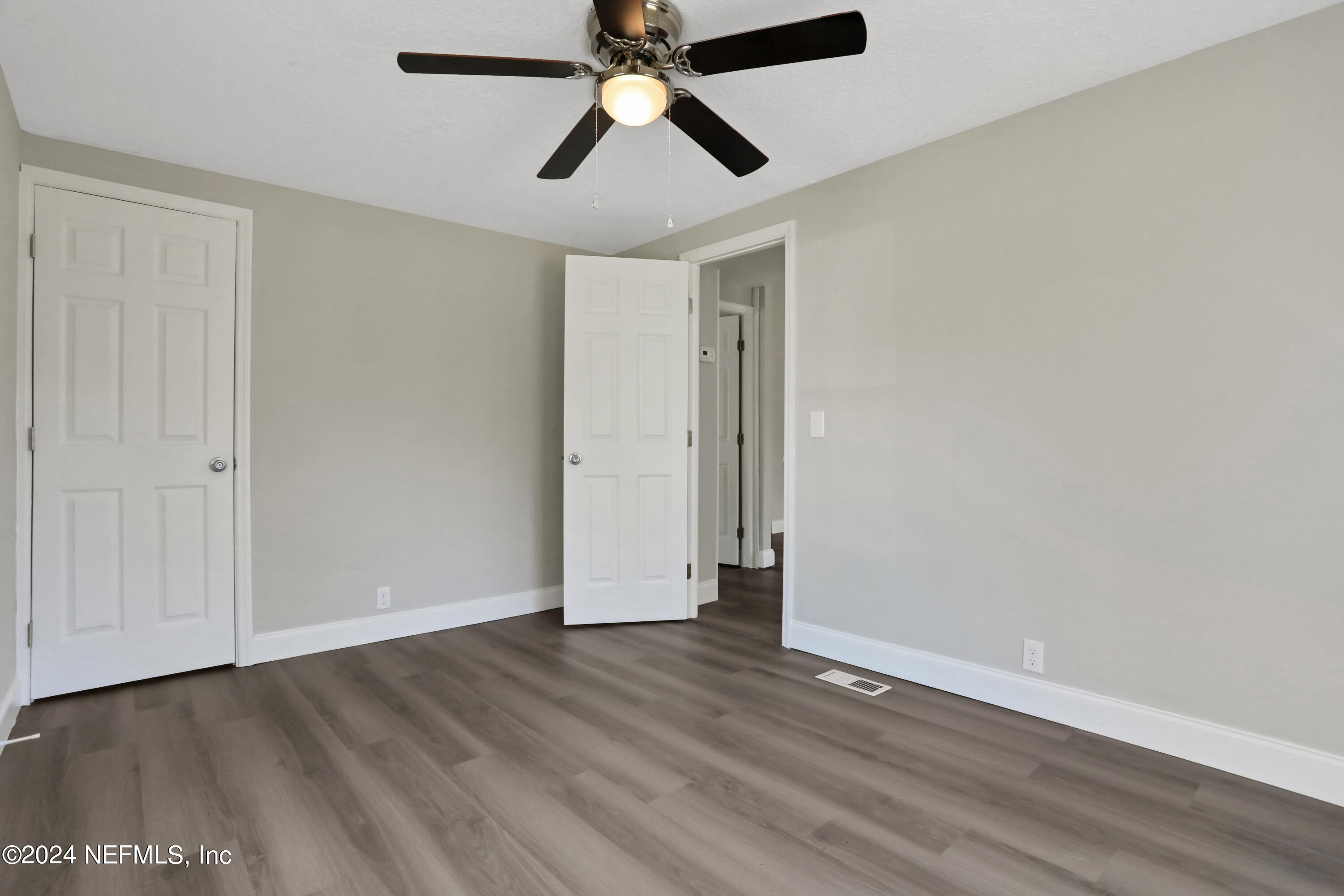 54057 Bea Road Callahan, FL 32011 - Photo 17 of 29 wooden floor in an empty room