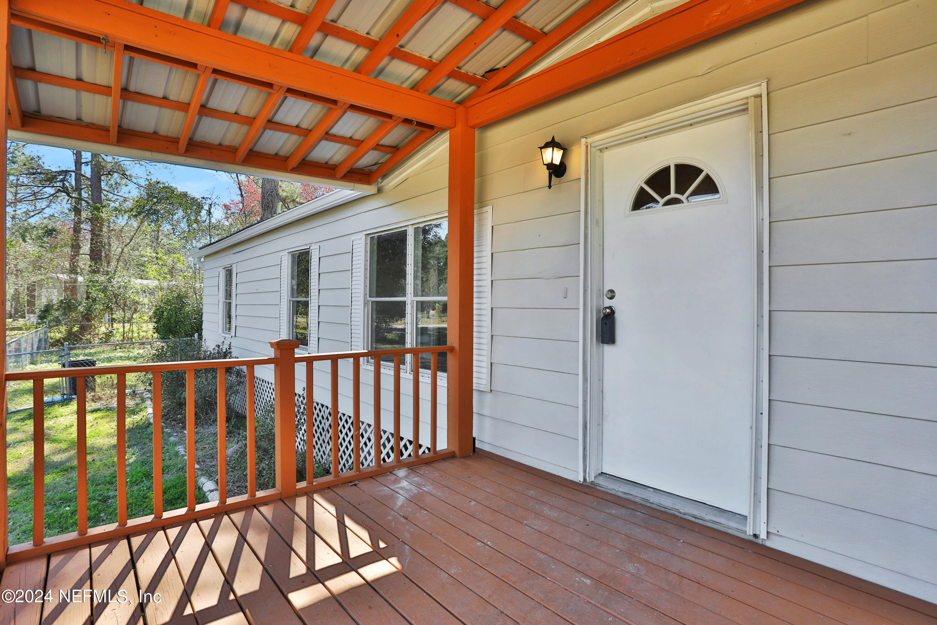 54057 Bea Road Callahan, FL 32011 - Photo 2 of 29 a view of wooden balcony
