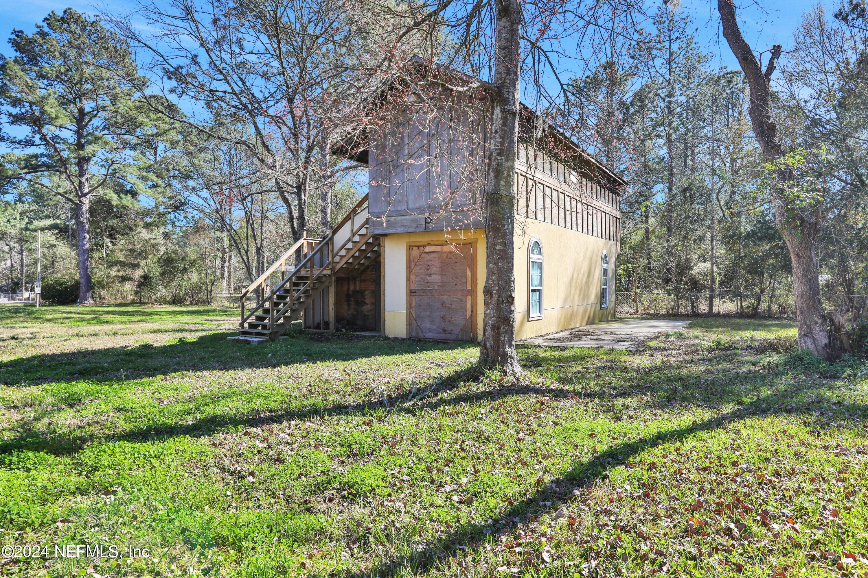 54057 Bea Road Callahan, FL 32011 - Photo 23 of 29 a view of a house with a yard