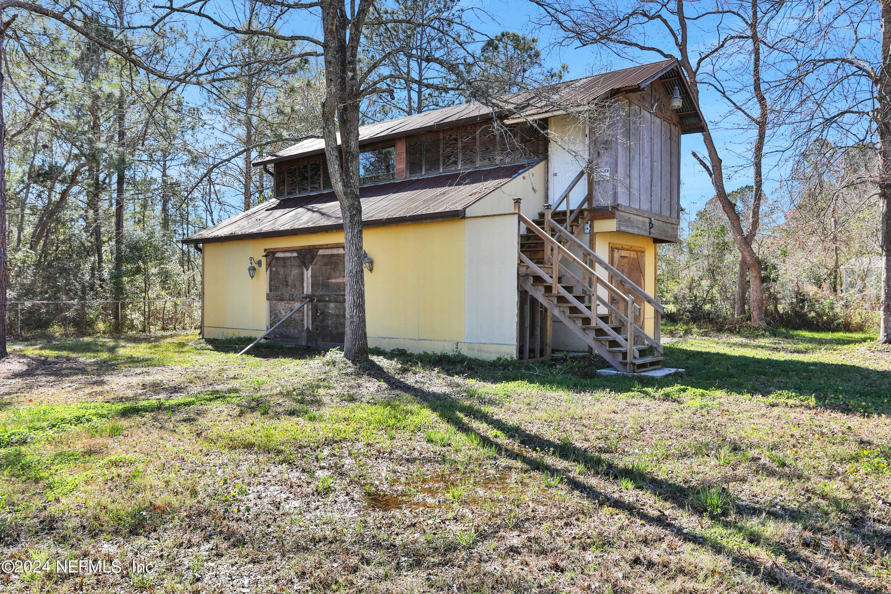 54057 Bea Road Callahan, FL 32011 - Photo 26 of 29 a view of a house with a yard