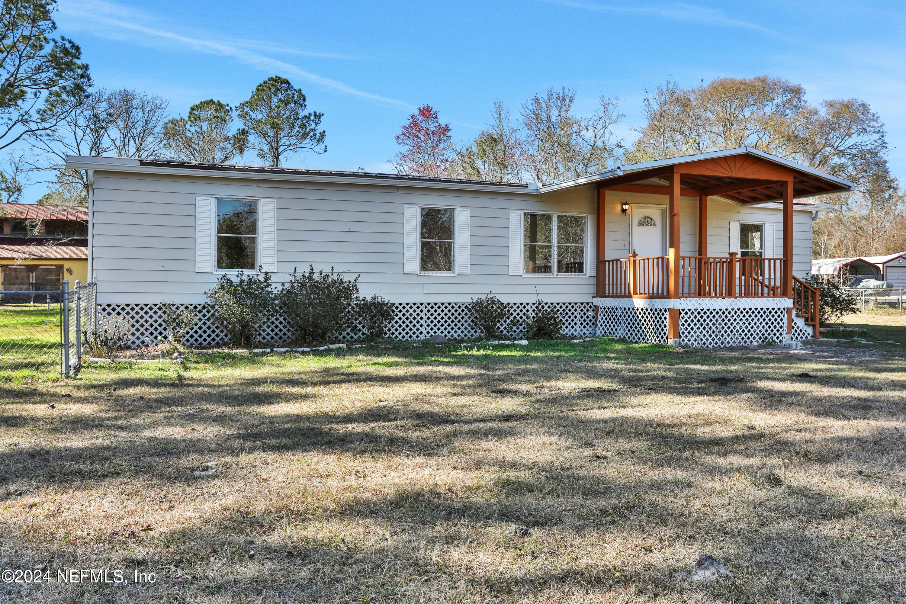 54057 Bea Road Callahan, FL 32011 - Photo 27 of 29 a view of a house with a yard