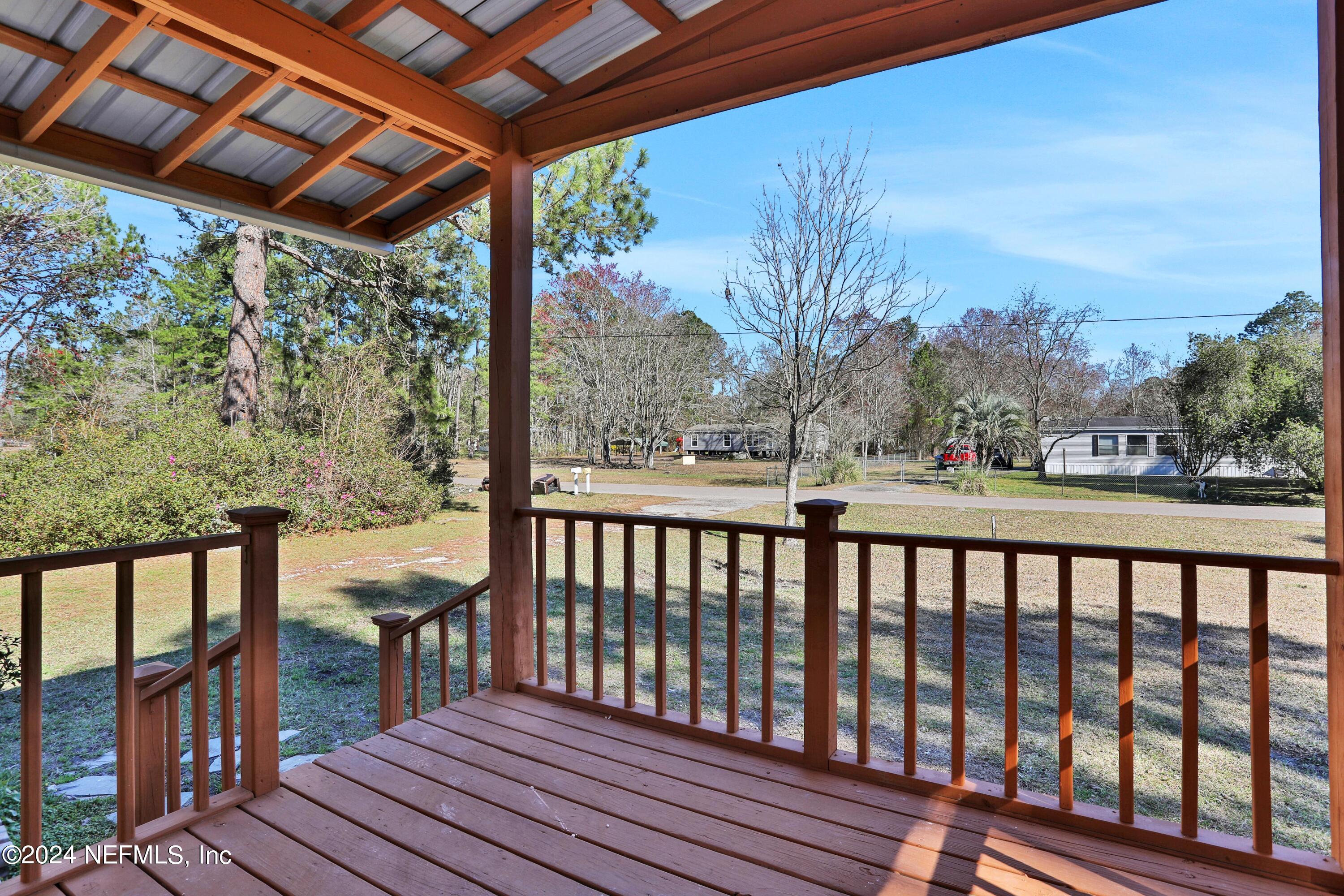 54057 Bea Road Callahan, FL 32011 - Photo 3 of 29 a view of a chairs on the roof deck
