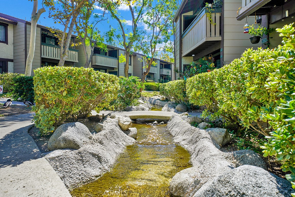 20702 El Toro Road, Unit 397 Lake Forest, CA 92630 - Photo 9 of 11 Streams and ponds thoughout the community property