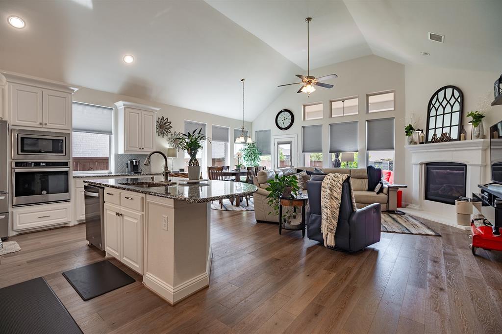 1213 Sea Island Road Aubrey, TX 76227 - Photo 15 of 36 Open-concept view from the kitchen into the living area, perfect for entertaining and family gatherings