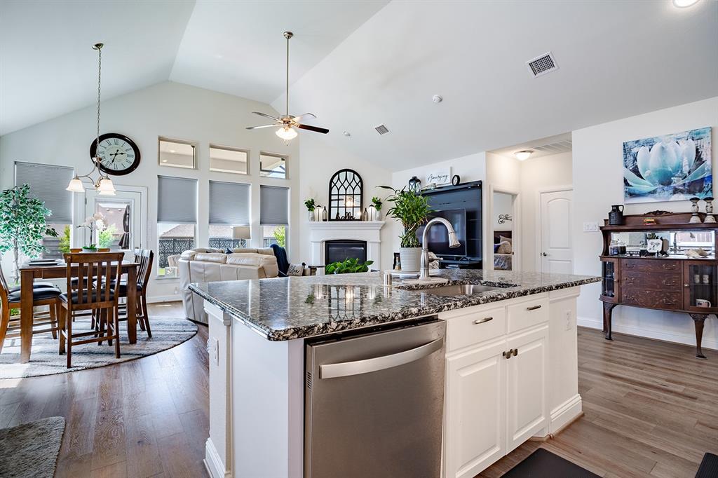 1213 Sea Island Road Aubrey, TX 76227 - Photo 17 of 36 Spacious kitchen island with stunning granite countertops, perfect for meal prep and entertaining.