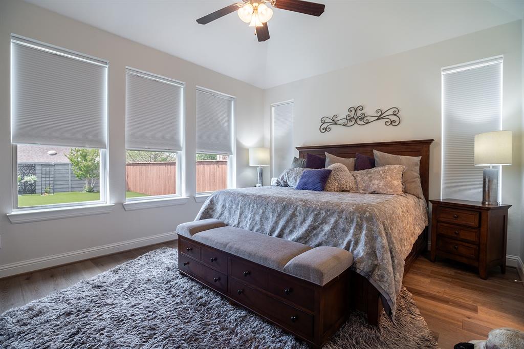 1213 Sea Island Road Aubrey, TX 76227 - Photo 22 of 36 Spacious primary bedroom with abundant natural light and a serene, relaxing atmosphere