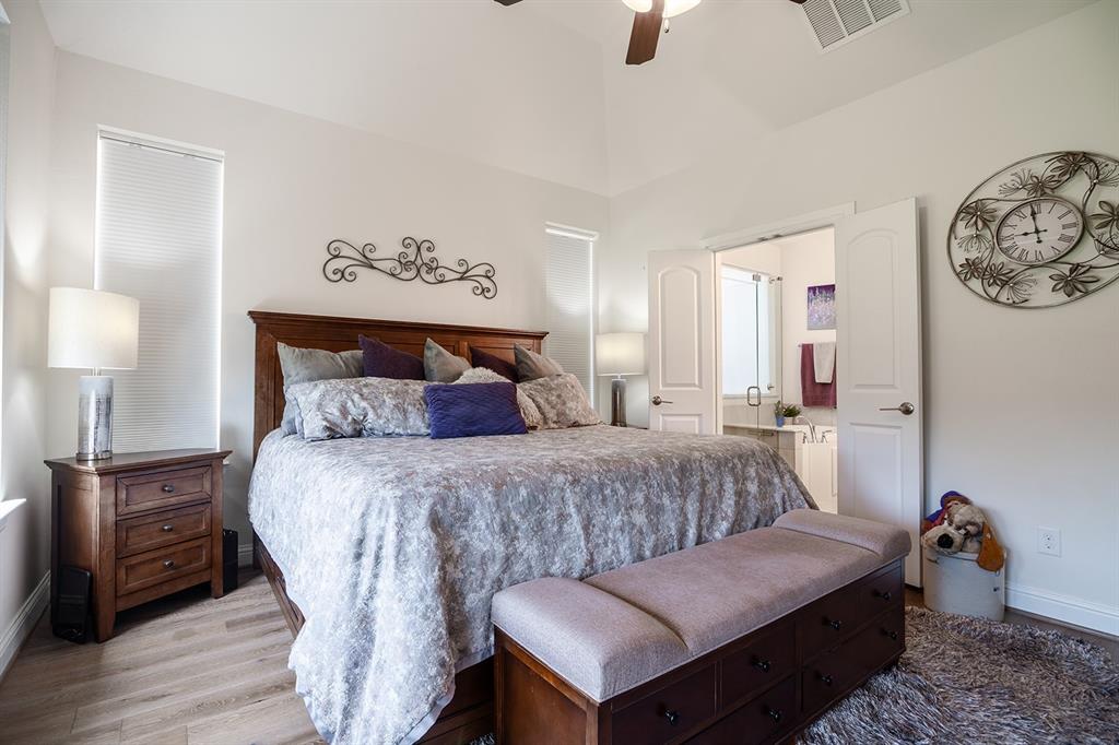 1213 Sea Island Road Aubrey, TX 76227 - Photo 23 of 36 Warm and inviting ensuite connection from the primary bedroom to the comfortable bathroom retreat