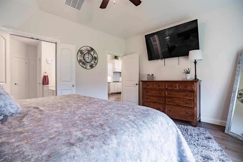 1213 Sea Island Road Aubrey, TX 76227 - Photo 24 of 36 Spacious primary bedroom with abundant natural light and a serene, relaxing atmosphere