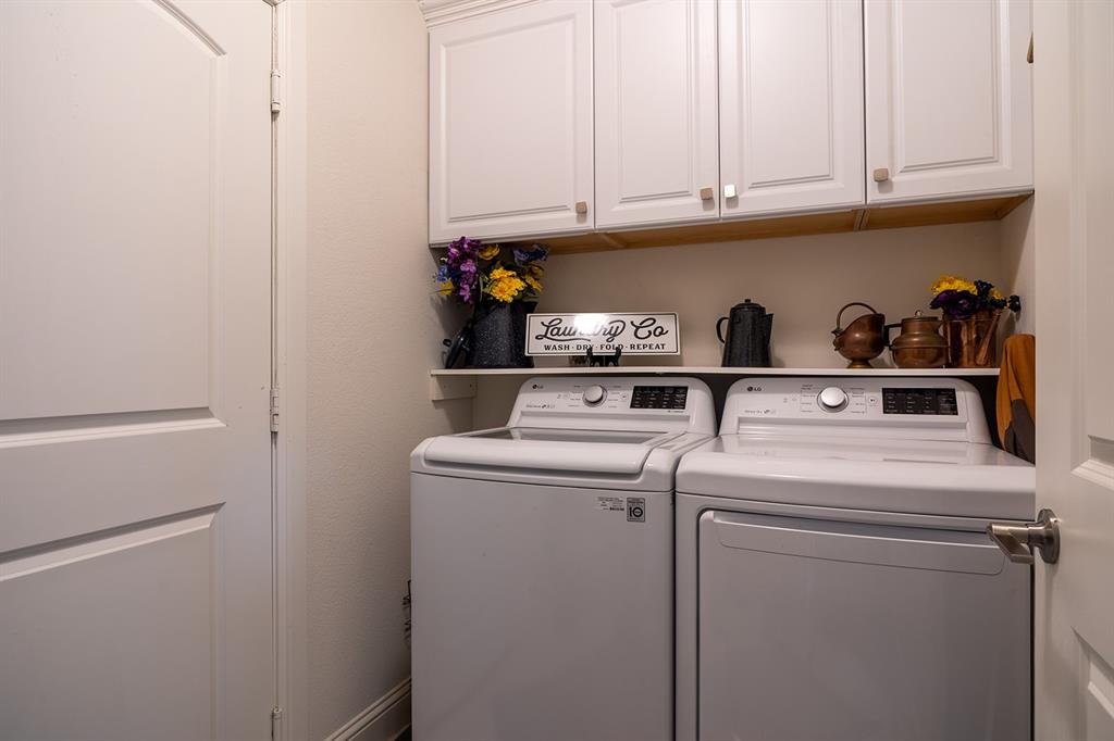 1213 Sea Island Road Aubrey, TX 76227 - Photo 29 of 36 Loundry with built in cabinets for more storage.