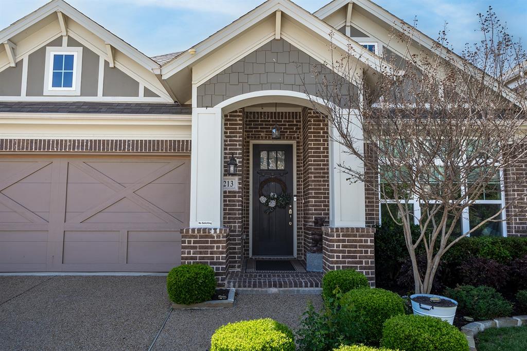 1213 Sea Island Road Aubrey, TX 76227 - Photo 4 of 36 Inviting single-story home with elegant arched entry and classic column accents