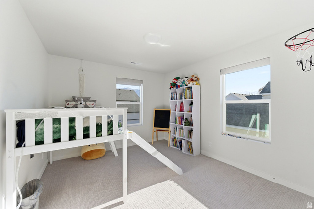 1038 South Old Towne Road Layton, UT 84041 - Photo 24 of 39 Bright room with carpet flooring and white walls