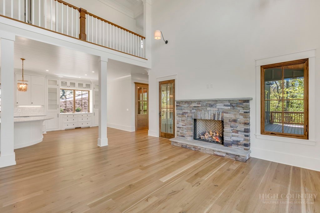 536 Boone Ridge Lane Boone, NC 28607 - Photo 10 of 50 a view of an empty room with window and fire place