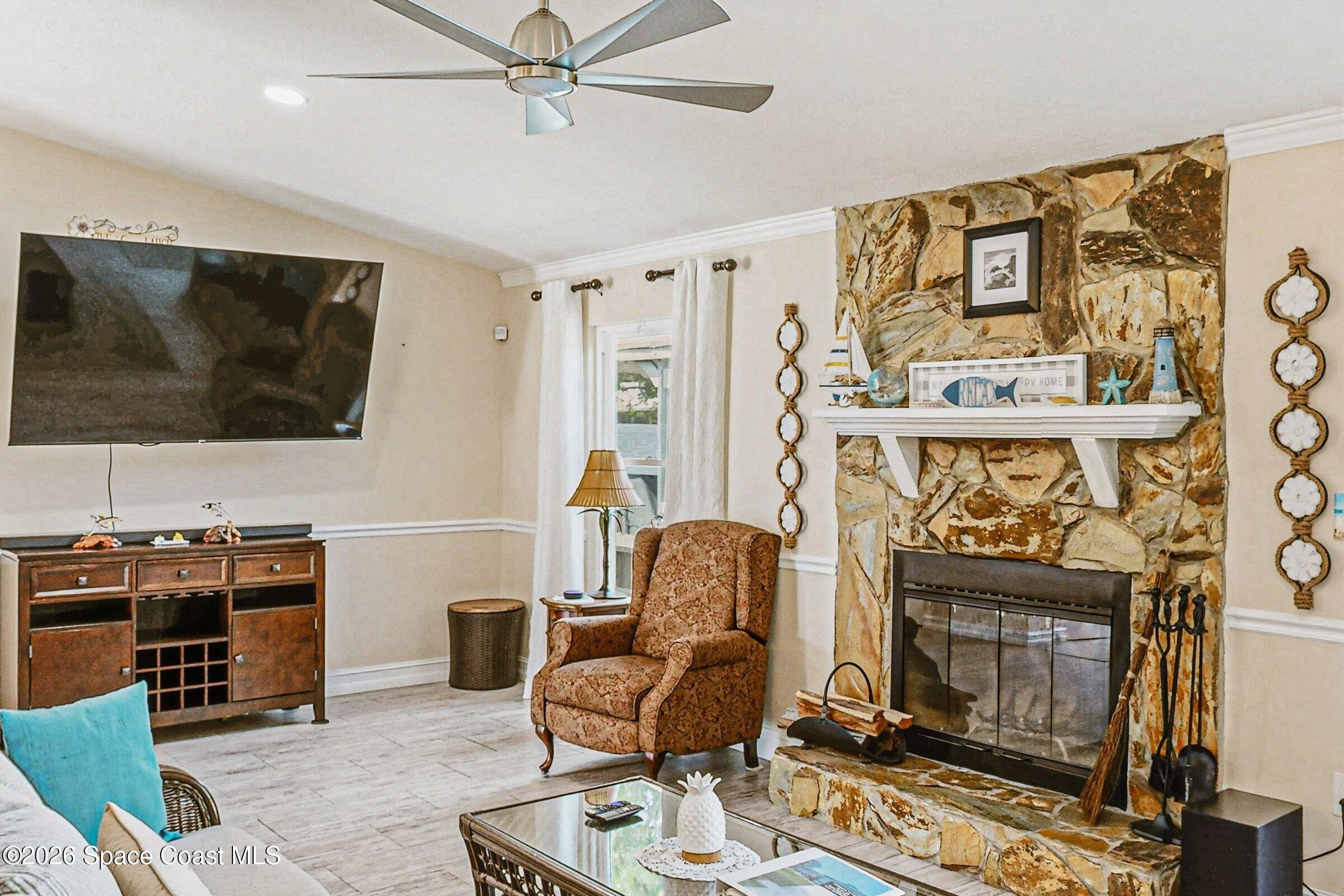 413 Orlov Road Northwest Palm Bay, FL 32907 - Photo 11 of 63 a living room with furniture and a flat screen tv