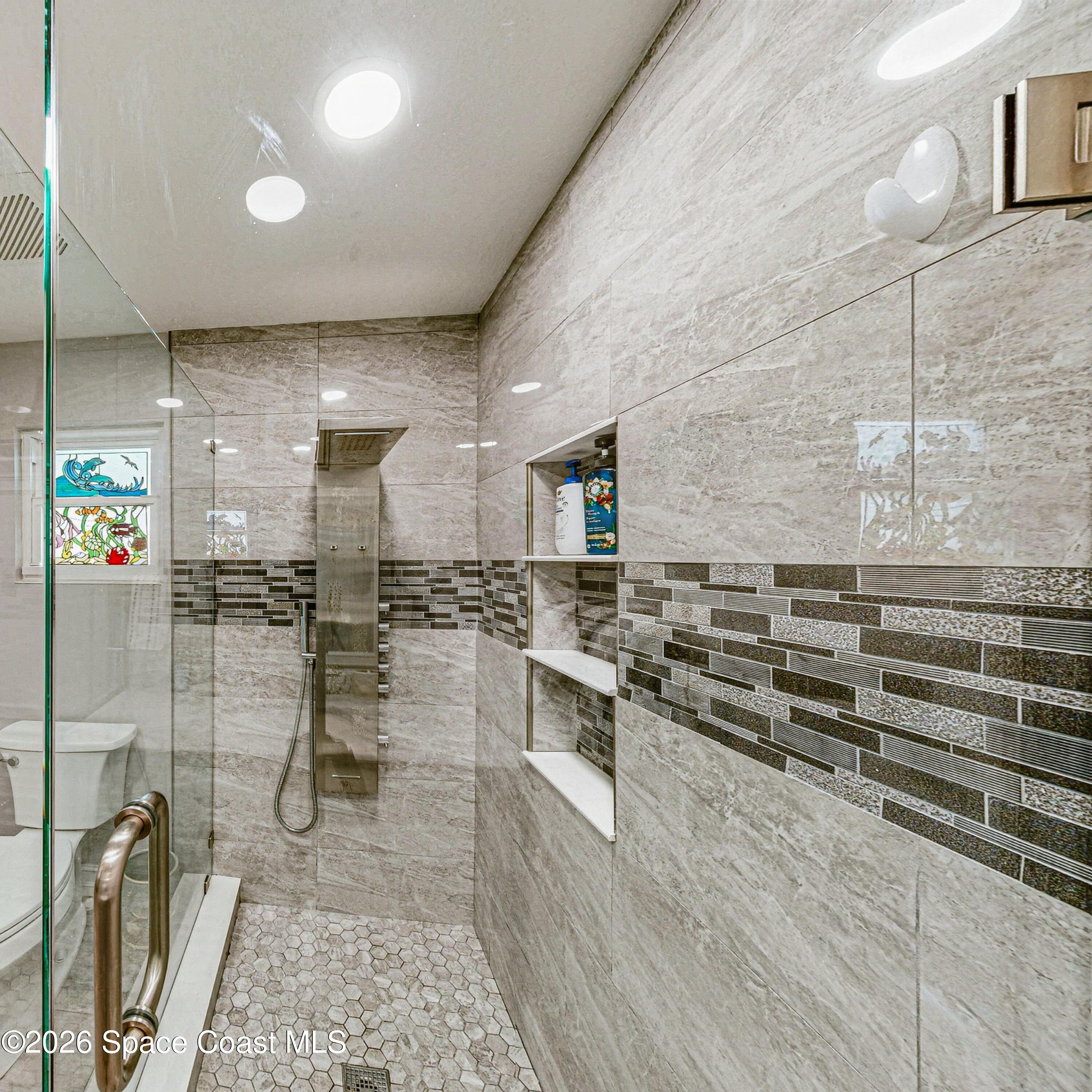 413 Orlov Road Northwest Palm Bay, FL 32907 - Photo 19 of 63 a kitchen with lots of counter top space and cabinets