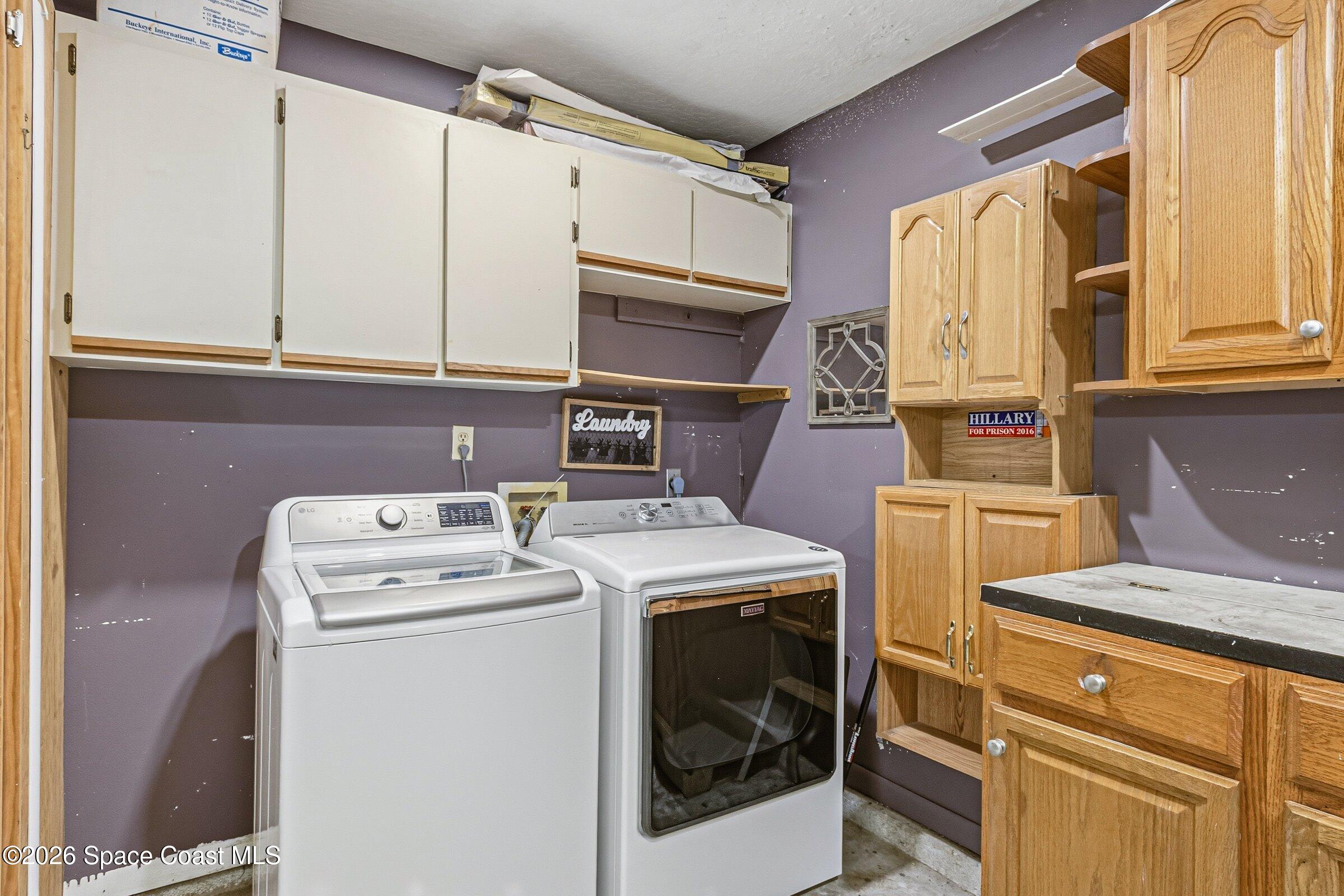 413 Orlov Road Northwest Palm Bay, FL 32907 - Photo 33 of 63 a utility room with dryer and washer