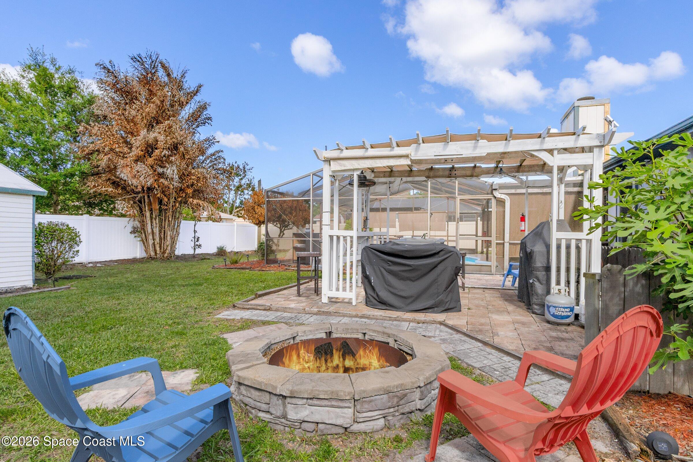 413 Orlov Road Northwest Palm Bay, FL 32907 - Photo 35 of 63 a view of an outdoor sitting area in a yard