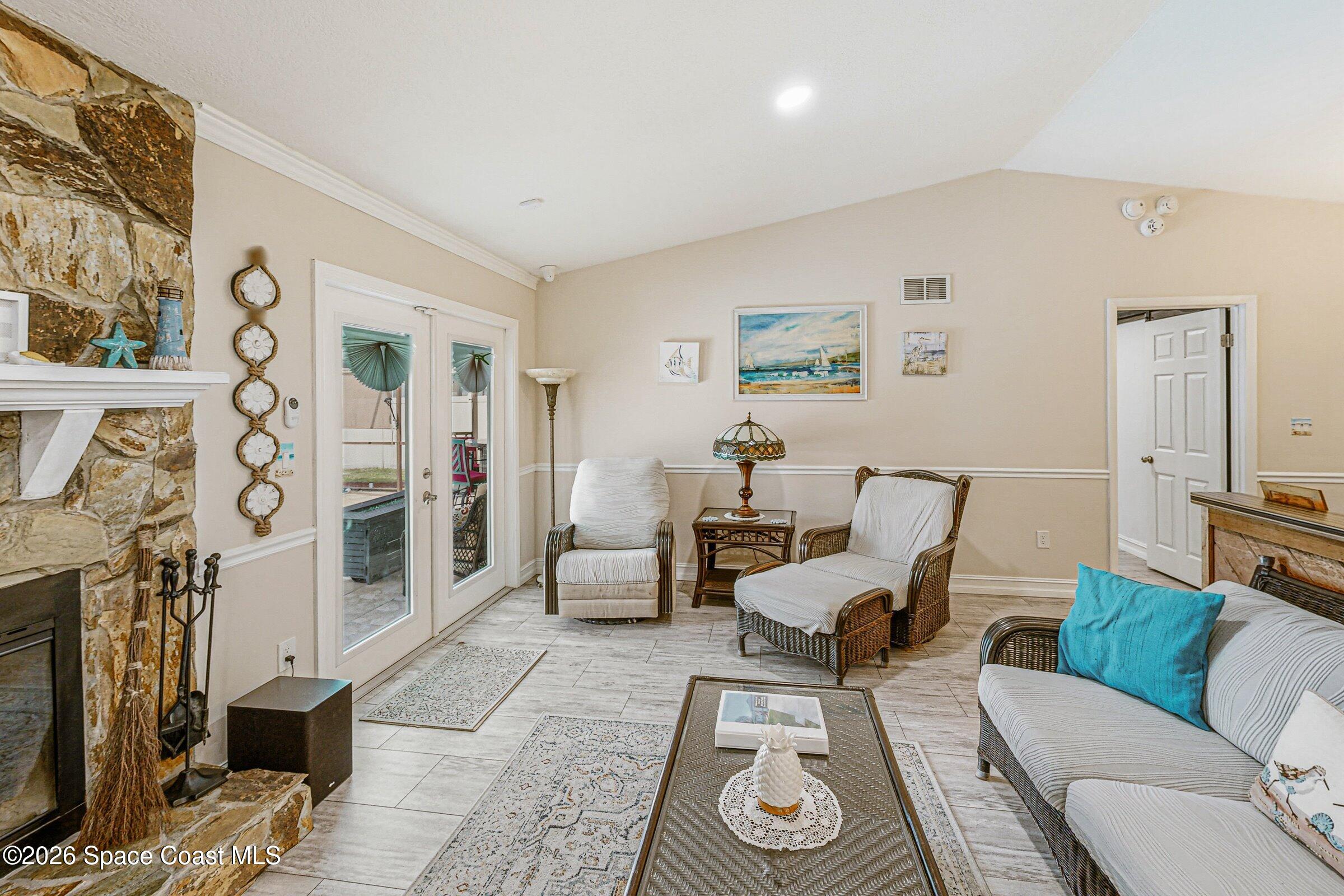 413 Orlov Road Northwest Palm Bay, FL 32907 - Photo 5 of 63 a living room with furniture and wooden floor
