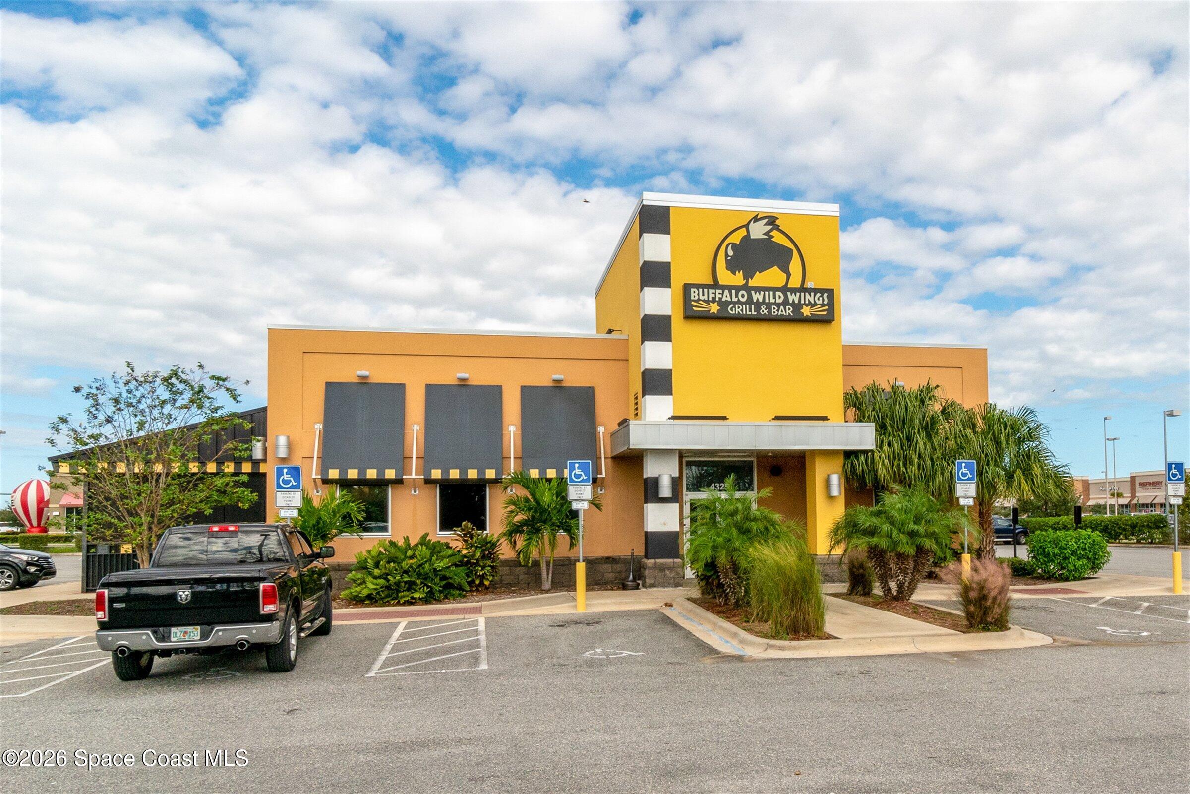 413 Orlov Road Northwest Palm Bay, FL 32907 - Photo 51 of 63 a car parked in front of a building