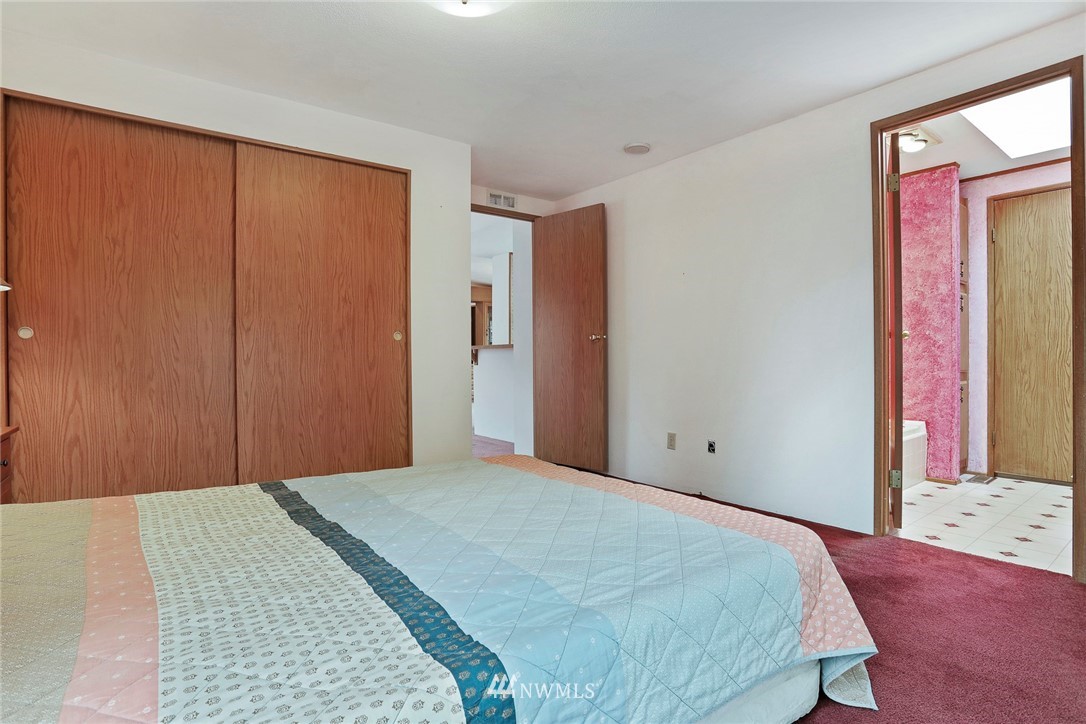 24031 10th Place West Bothell, WA 98021 - Photo 16 of 32 a bedroom with a bed and a window