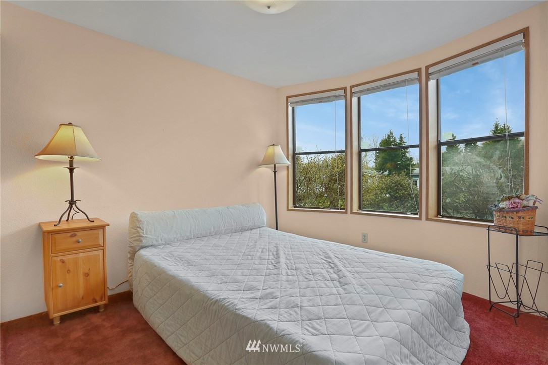 24031 10th Place West Bothell, WA 98021 - Photo 18 of 32 a bedroom with a bed and a window