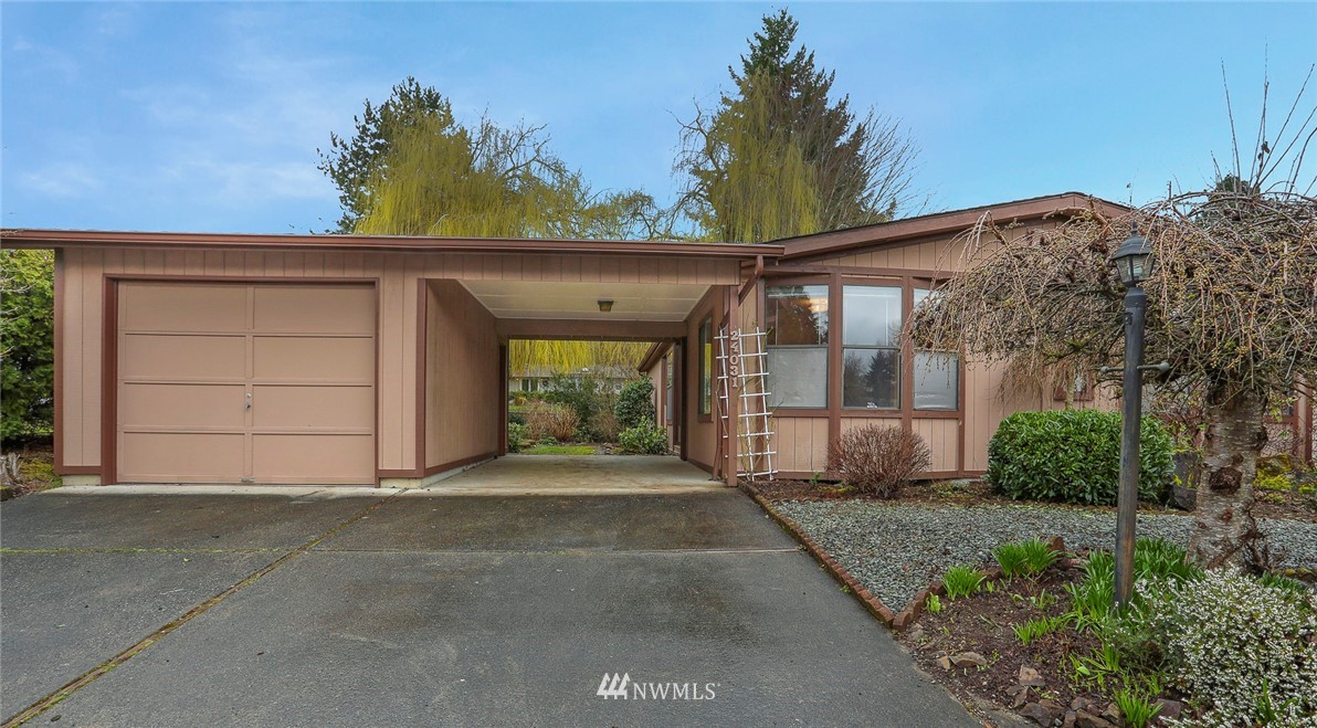 24031 10th Place West Bothell, WA 98021 - Photo 2 of 32 a front view of a house with a yard and garage