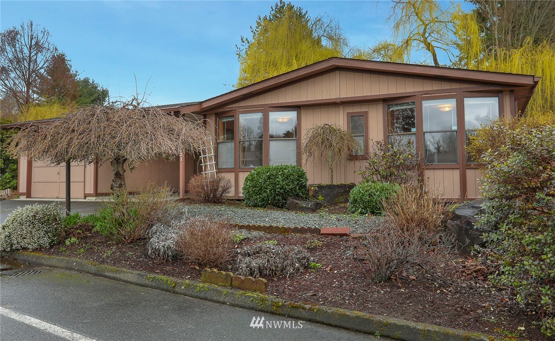 24031 10th Place West Bothell, WA 98021 - Photo 25 of 32 a front view of a house with garden