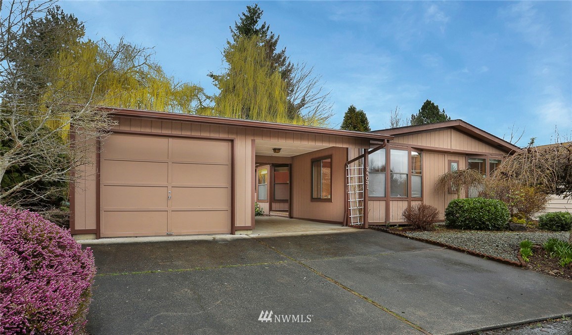 24031 10th Place West Bothell, WA 98021 - Photo 26 of 32 a front view of a house with a garage