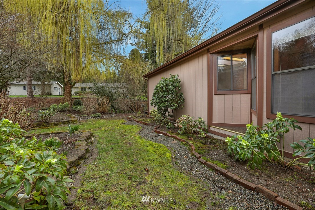 24031 10th Place West Bothell, WA 98021 - Photo 27 of 32 a view of a house with a yard