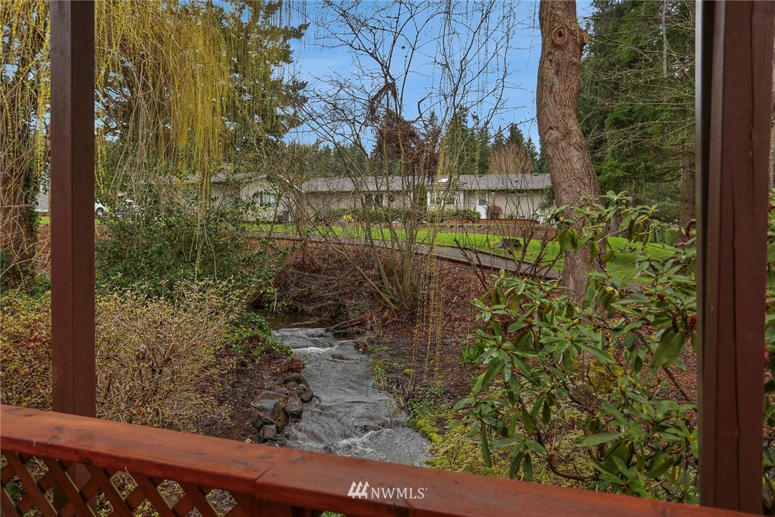 24031 10th Place West Bothell, WA 98021 - Photo 30 of 32 a view of a yard with plants