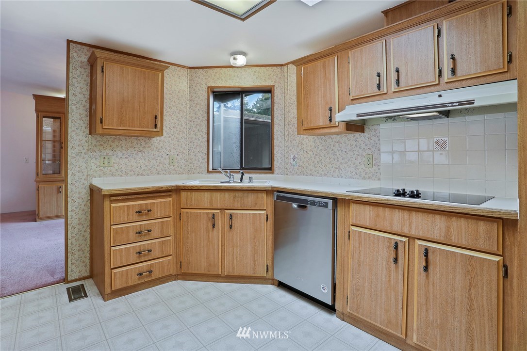 24031 10th Place West Bothell, WA 98021 - Photo 8 of 32 a kitchen with cabinets appliances and a window