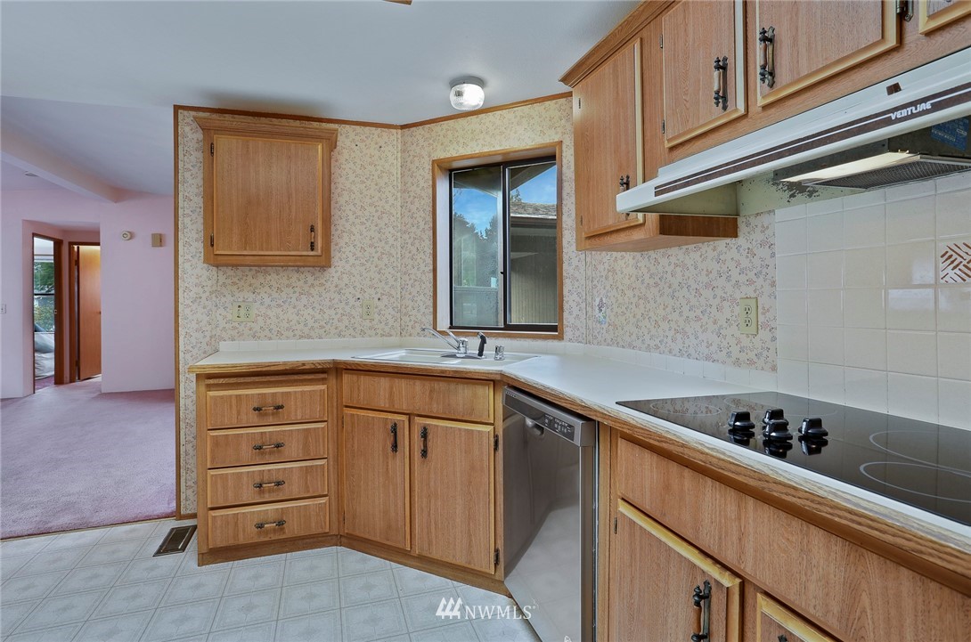 24031 10th Place West Bothell, WA 98021 - Photo 9 of 32 a kitchen with cabinets appliances and a window