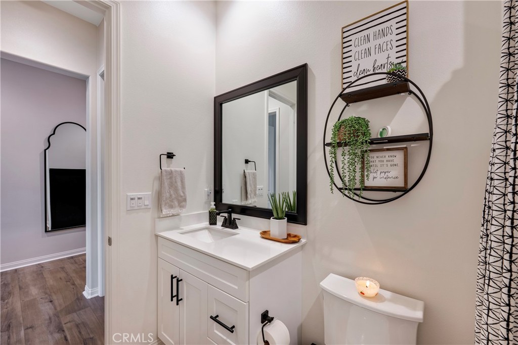 4124 Cameron Way Corona, CA 92883 - Photo 18 of 76 a bathroom with a sink and a mirror
