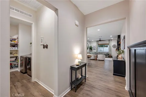 a kitchen with stainless steel appliances kitchen island granite countertop a refrigerator a stove and a sink