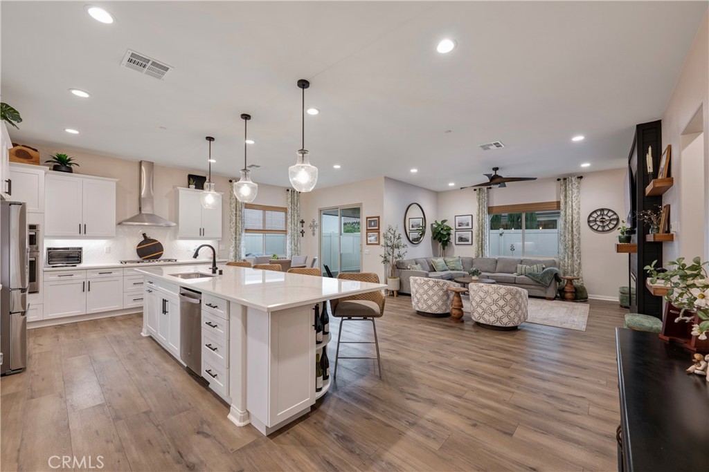 4124 Cameron Way Corona, CA 92883 - Photo 22 of 76 a large kitchen with stainless steel appliances