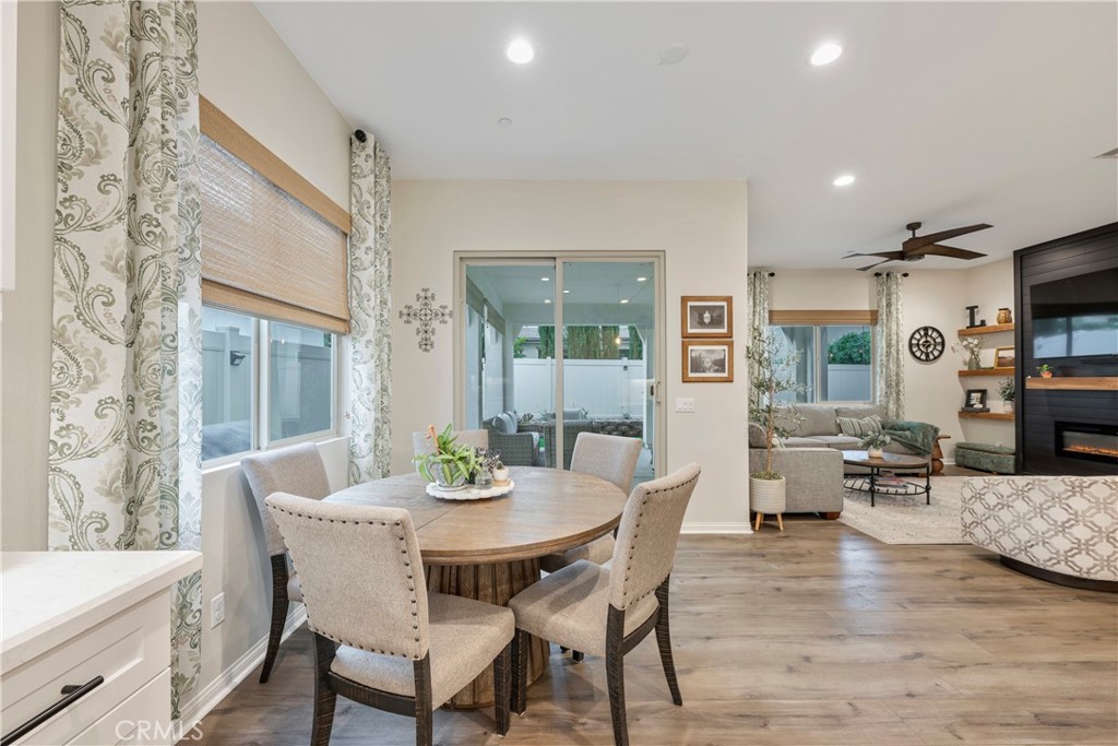 4124 Cameron Way Corona, CA 92883 - Photo 31 of 76 a view of a dining room with furniture and wooden floor