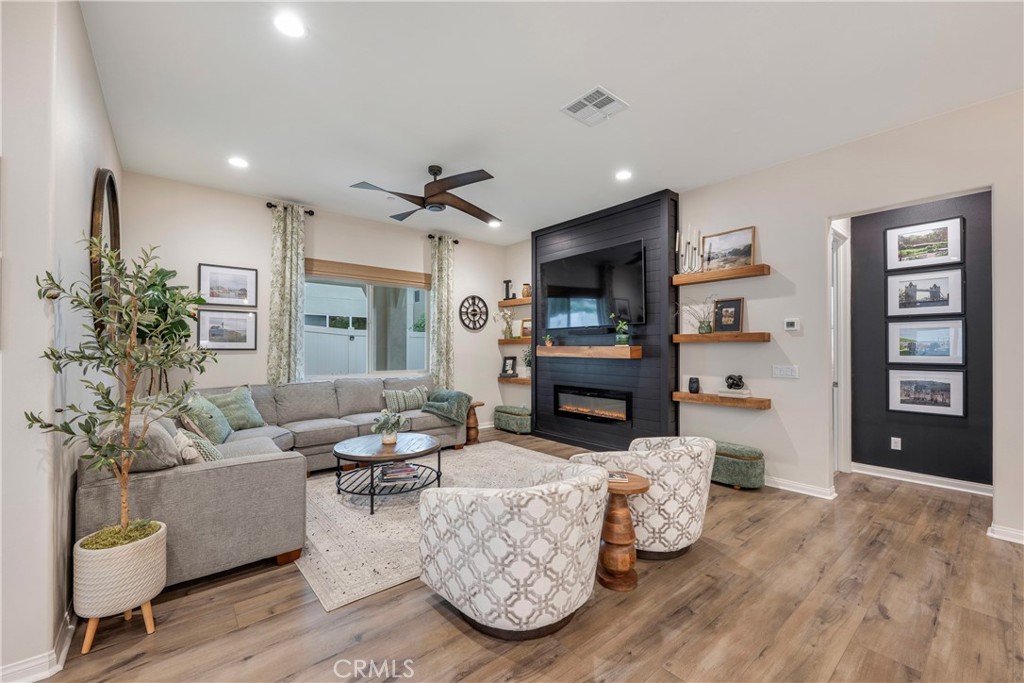 4124 Cameron Way Corona, CA 92883 - Photo 35 of 76 a living room with furniture and a fireplace