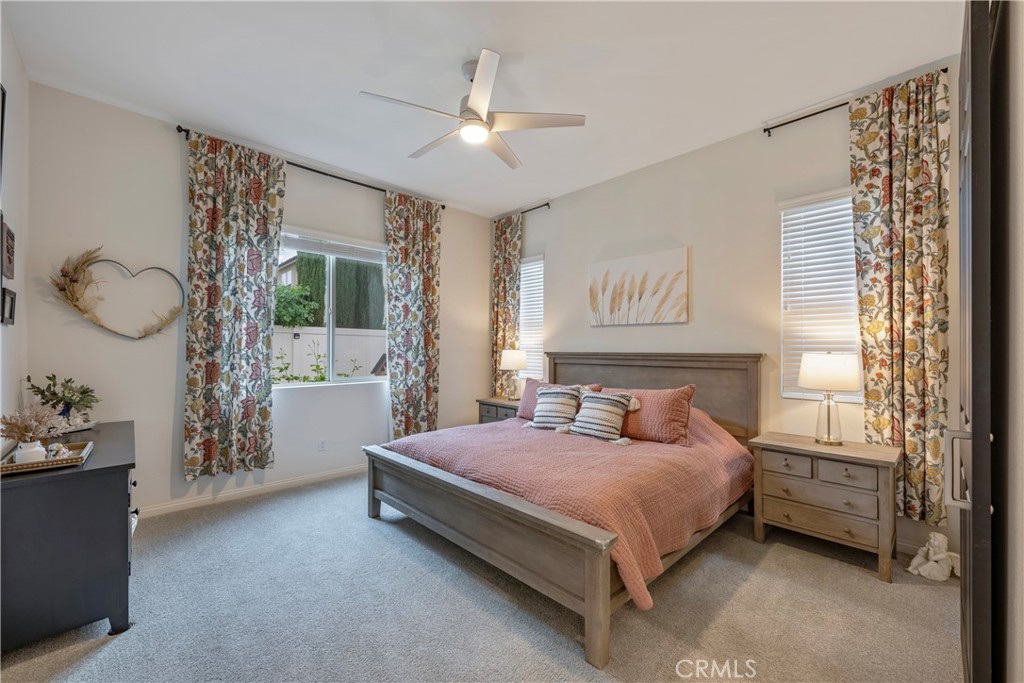 4124 Cameron Way Corona, CA 92883 - Photo 40 of 76 a bedroom with a bed couch and window