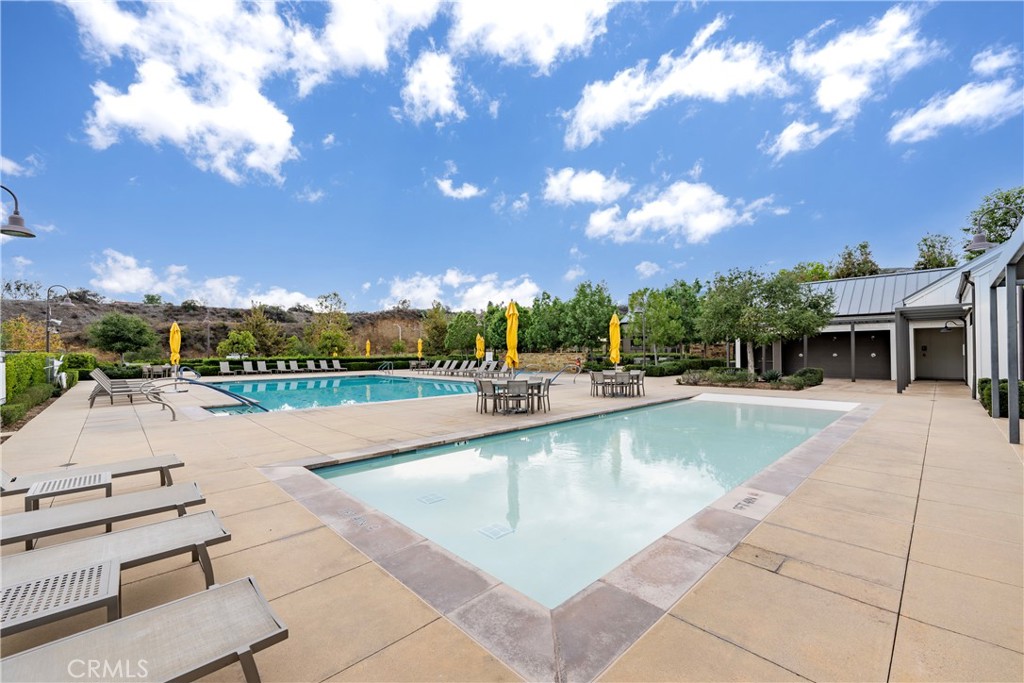 4124 Cameron Way Corona, CA 92883 - Photo 62 of 76 a swimming pool with outdoor seating and outdoor shower