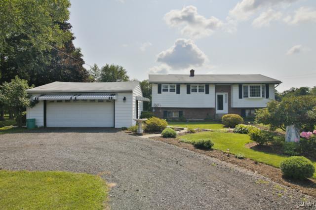 1280 Seifert Road Nazareth, PA 18064 - Photo 1 of 49 a front view of house with yard and trees in the background