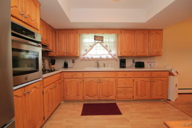 1280 Seifert Road Nazareth, PA 18064 - Photo 25 of 49 a kitchen with stainless steel appliances granite countertop a stove a sink and a microwave