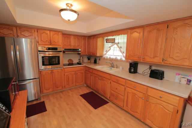 1280 Seifert Road Nazareth, PA 18064 - Photo 28 of 49 a kitchen with stainless steel appliances granite countertop a refrigerator sink and cabinets