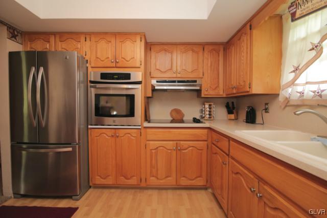 1280 Seifert Road Nazareth, PA 18064 - Photo 31 of 49 a kitchen with stainless steel appliances granite countertop a refrigerator sink and cabinets