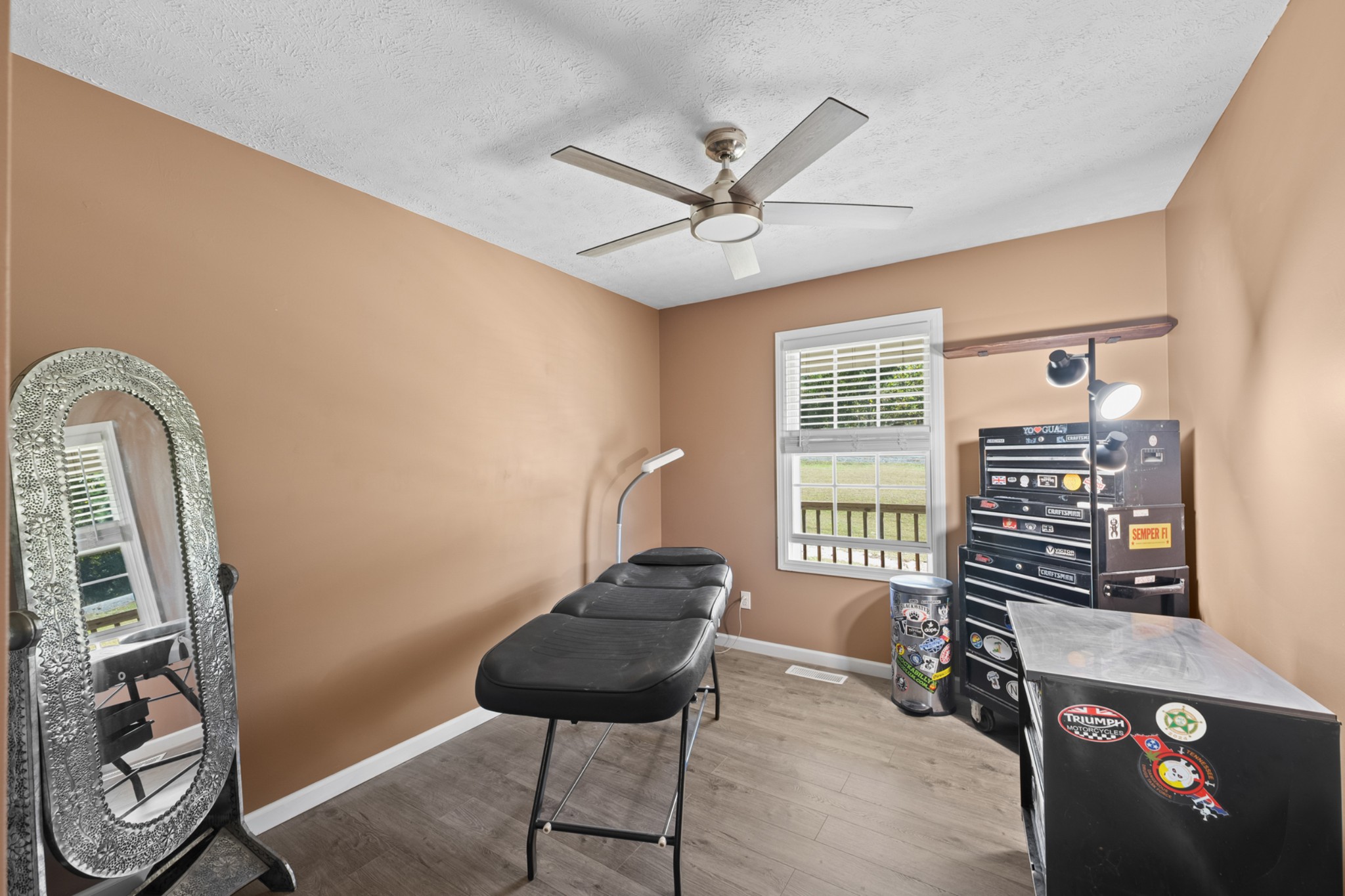 936 Adams Road Tracy City, TN 37387 - Photo 14 of 28 a bedroom with a bed and a chandelier